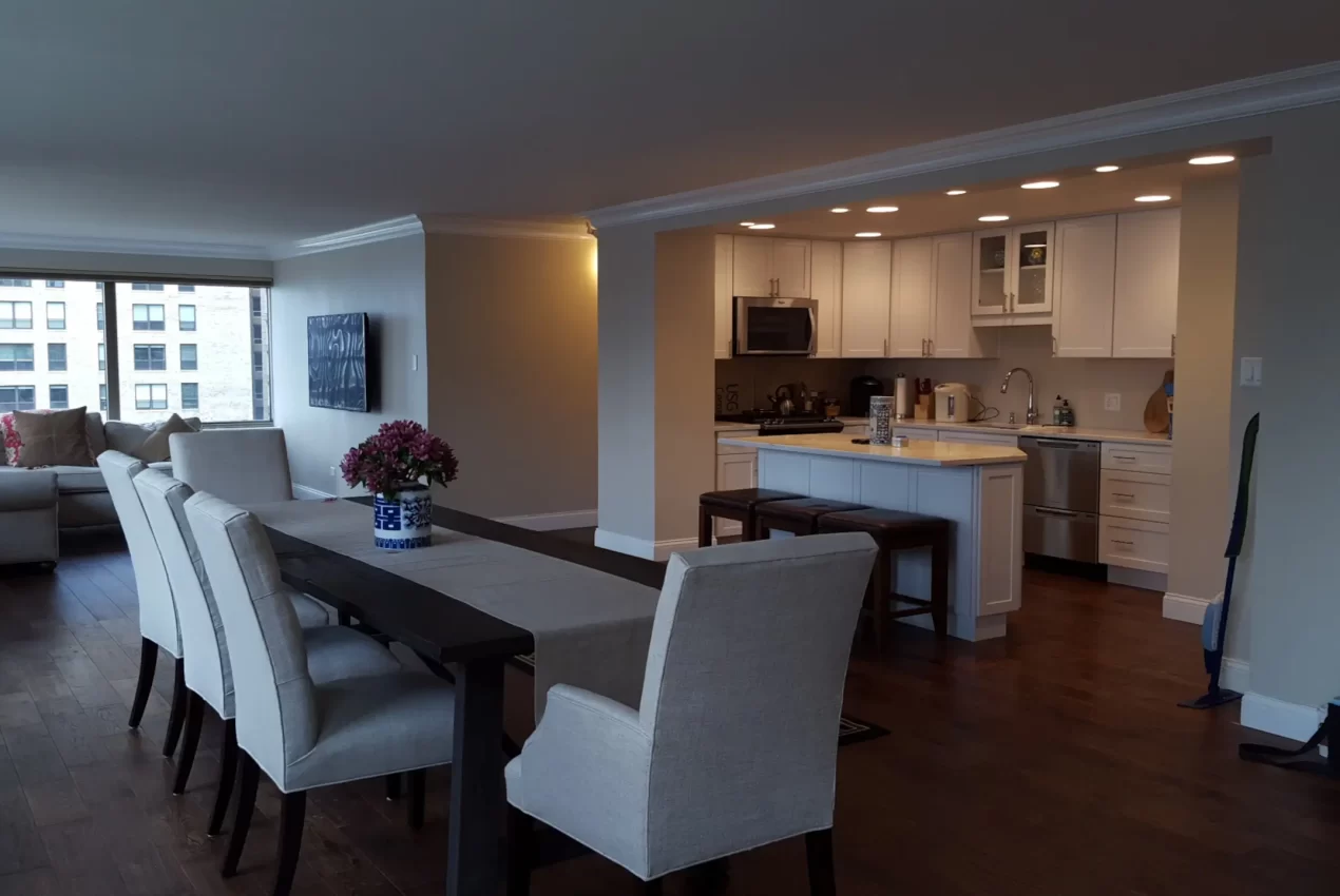 Modern kitchen renovation with white cabinets and granite countertops