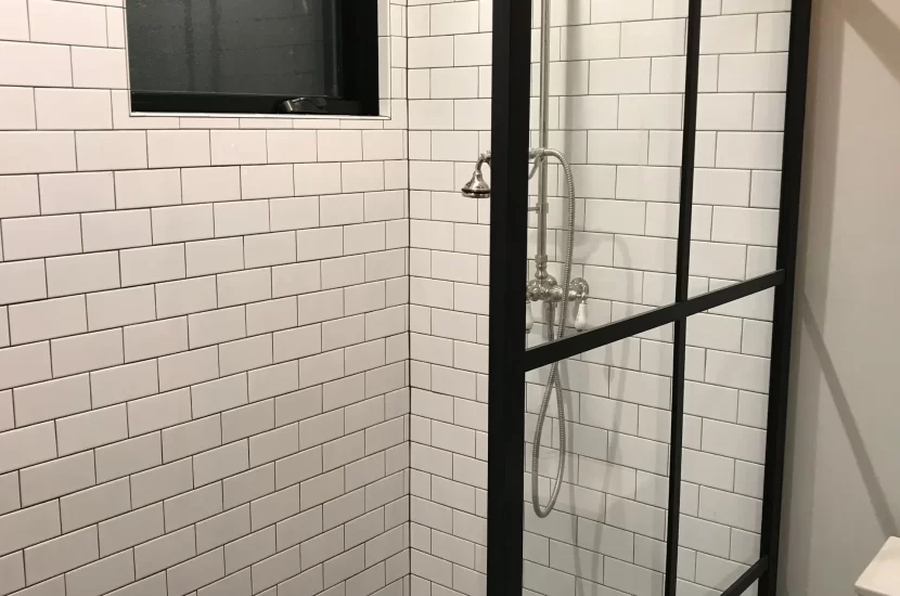 Wheaton bathroom remodel with white subway tile shower and black frame glass door